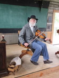 truman price playing fiddle living history festival