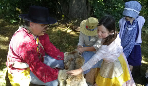 what is living history kids touch furs of animals brought by mountain man trapper