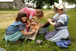 girls washing pioneer clothes farm homestead singing creek center