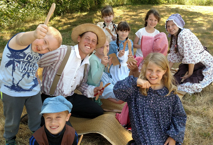 homeschool kids making wooden spoons homesteading