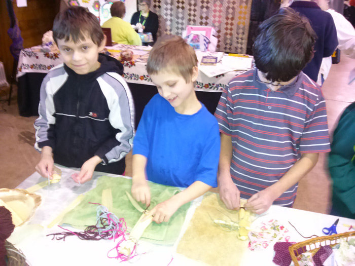 boys making corn dolls singing creek ed center