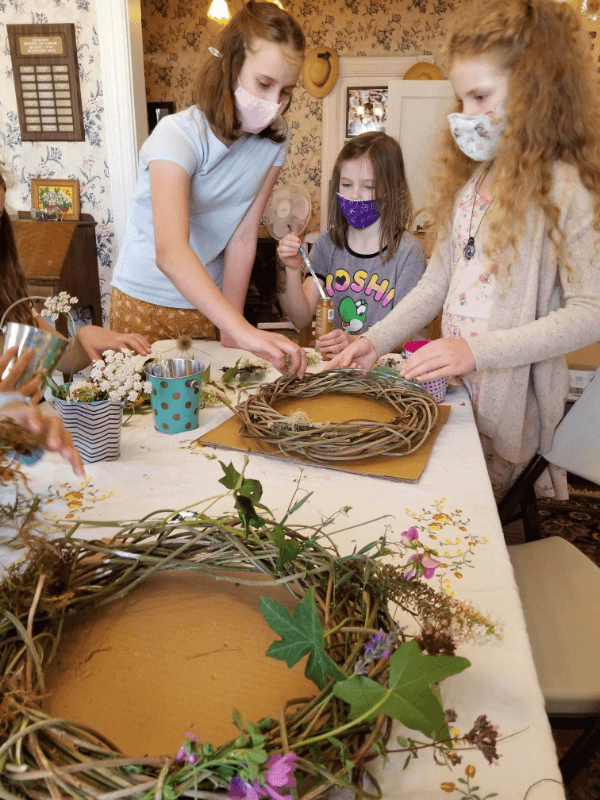 making wreaths with natural objects in SCEC summer camp making flower wreaths summer camp
