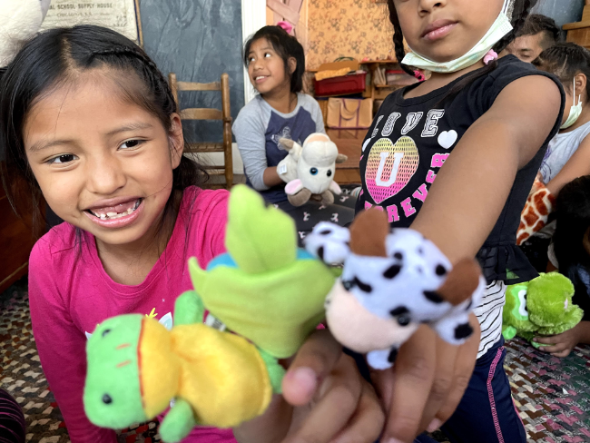 kids playing with puppets at summer camp scec