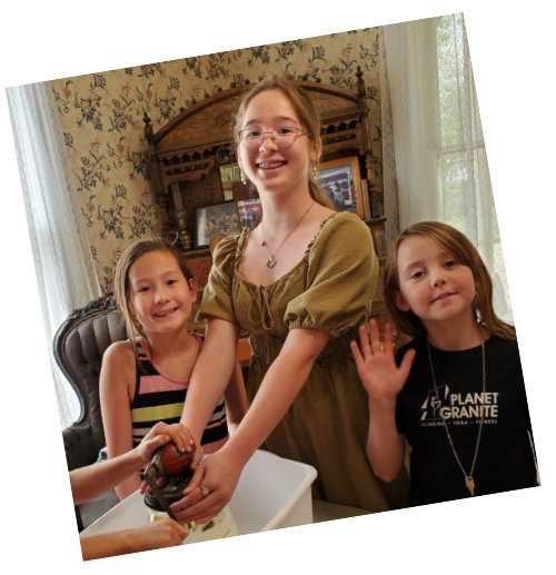 kids churning butter at summer camp