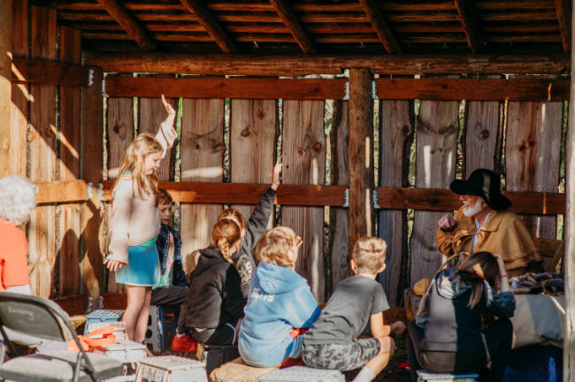 kids with Kevin trapper at shed fur trapper