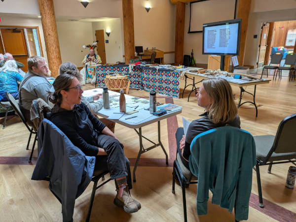 teachers talking at tables indigenous day