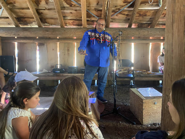 Deitz peters storytelling inside plankhouse