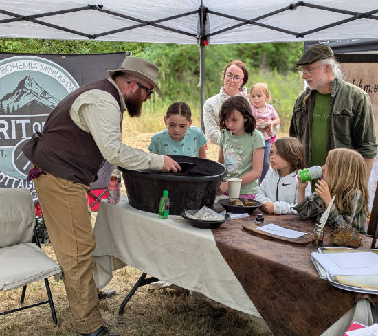 Matthew Hewlett gold panning booth